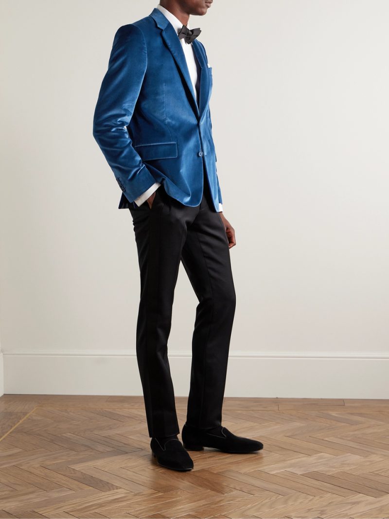 Step out in a blue velvet tuxedo jacket from a brand like Paul Smith for a bold New Year's statement.