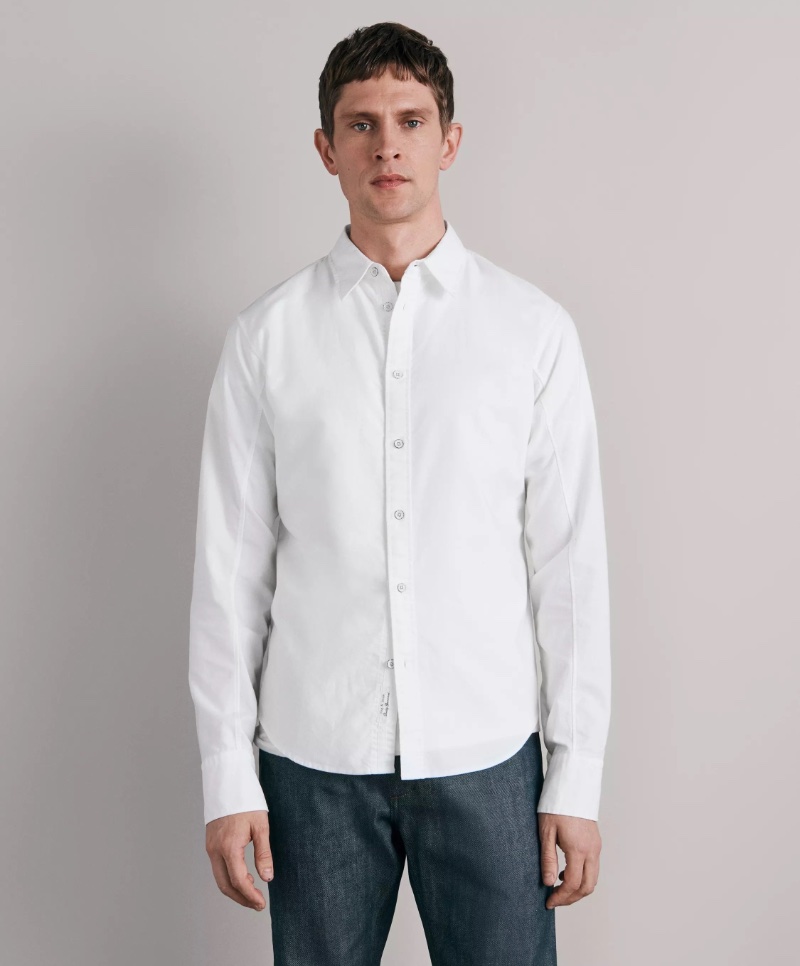 Embrace the white Oxford shirt as an effortless essential for smart dressing. 