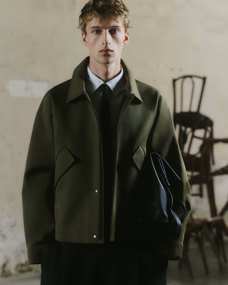 Vasko Luyckx wears a textured Zara cotton jacket with a poplin pocket shirt, balloon fit pants, and a silk tie.