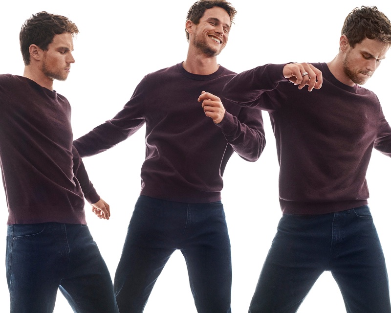 Rocking a sweatshirt and jeans, Brandon Flynn appears in Calvin Klein's holiday 2023 advertisement.