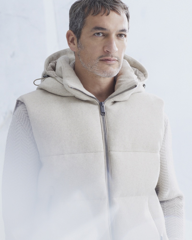 Ilay Kurelovic dons a down puffer vest from the Brioni Wintertime Capsule collection.