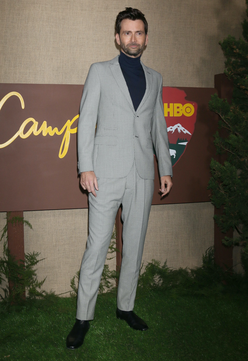 David Tennant inspires in a deep navy turtleneck that anchors a houndstooth suit, epitomizing understated elegance.