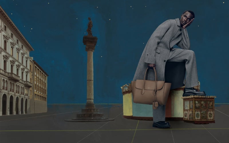 Malick Bodian dons a grey coat and trousers with black leather loafers for Ferragamo's holiday 2023 campaign. » Florence in Focus: Ferragamo's Theatrical Holiday Campaign Malick Bodian dons a grey coat and trousers with black leather loafers for Ferragamo's holiday 2023 campaign.