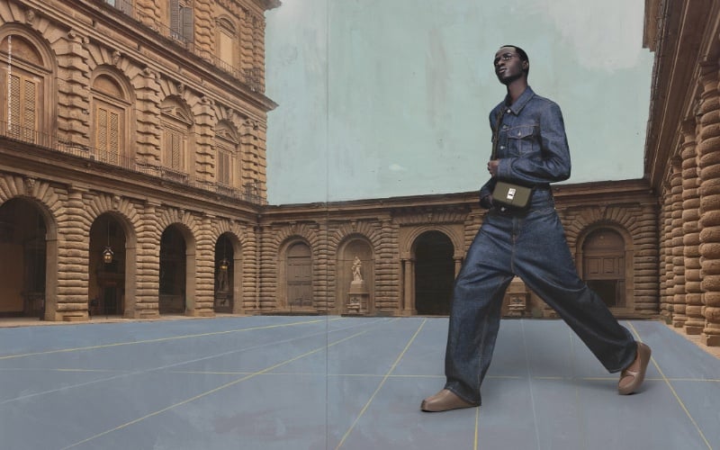 Wearing double denim, Malick Bodian appears in Ferragamo's holiday 2023 campaign. » Florence in Focus: Ferragamo's Theatrical Holiday Campaign Wearing double denim, Malick Bodian appears in Ferragamo's holiday 2023 campaign.