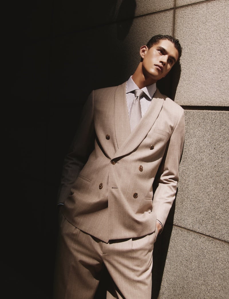 Bodhi Heeck stands poised in a tailored Giorgio Armani beige double-breasted suit. » Giorgio Armani's Unisex Collection Lands at Selfridges Bodhi Heeck stands poised in a tailored Giorgio Armani beige double-breasted suit.