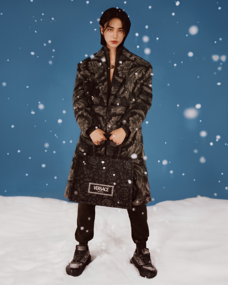 Embracing Versace's Barocco print, Hyunjin appears in the fashion house's holiday 2023 campaign.