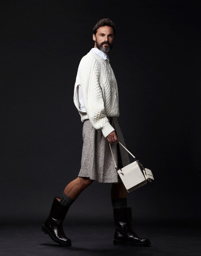 For Neo2, Iván Sánchez redefines knitwear chic in a textured Dior Men's sweater and contrasting kilt.