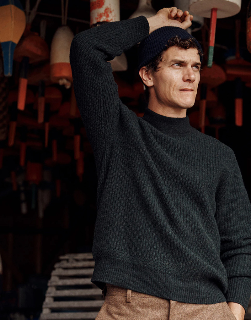 Donning winter style, Vincent LaCrocq wears a ribbed wool mock-neck sweater.