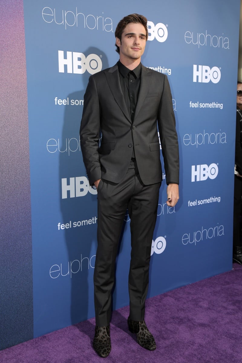 Jacob Elordi exudes sleek sophistication at the Los Angeles premiere of Euphoria, styled in a sharp all-black suit complemented by statement leopard print loafers.