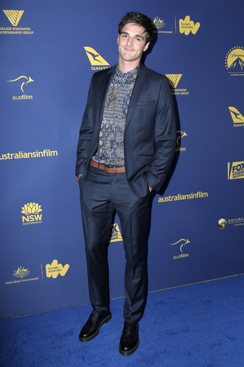 Jacob Elordi brings a touch of his unique style to the Australians in Film Awards, donning a tailored plaid suit with a bohemian twist, courtesy of a paisley band-collar shirt, and finishing the ensemble with classic black brogues.