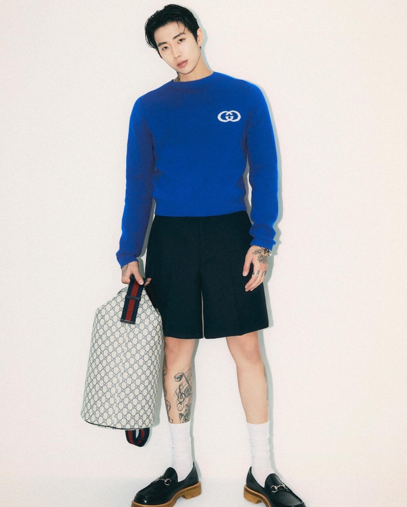 Jay Park exudes casual chic as Gucci's global ambassador, pairing a cobalt blue sweater with tailored shorts and statement loafers.