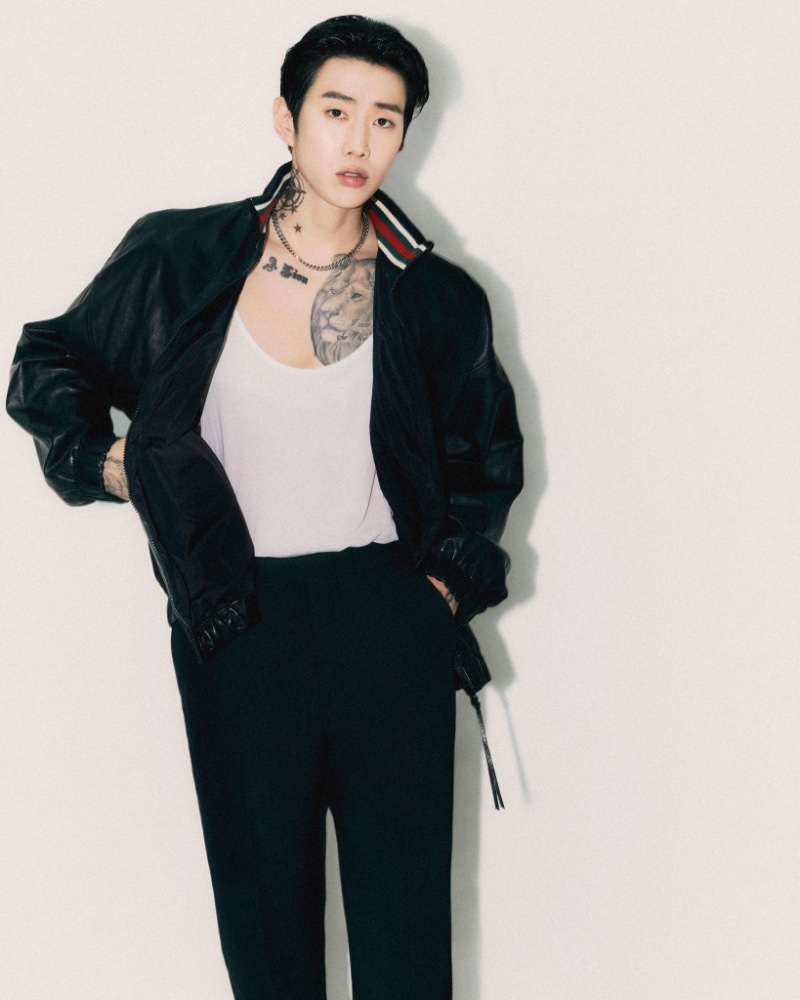 Channeling effortless edge, Jay Park models a Gucci ensemble, showcasing a classic bomber jacket and bold tattoos.