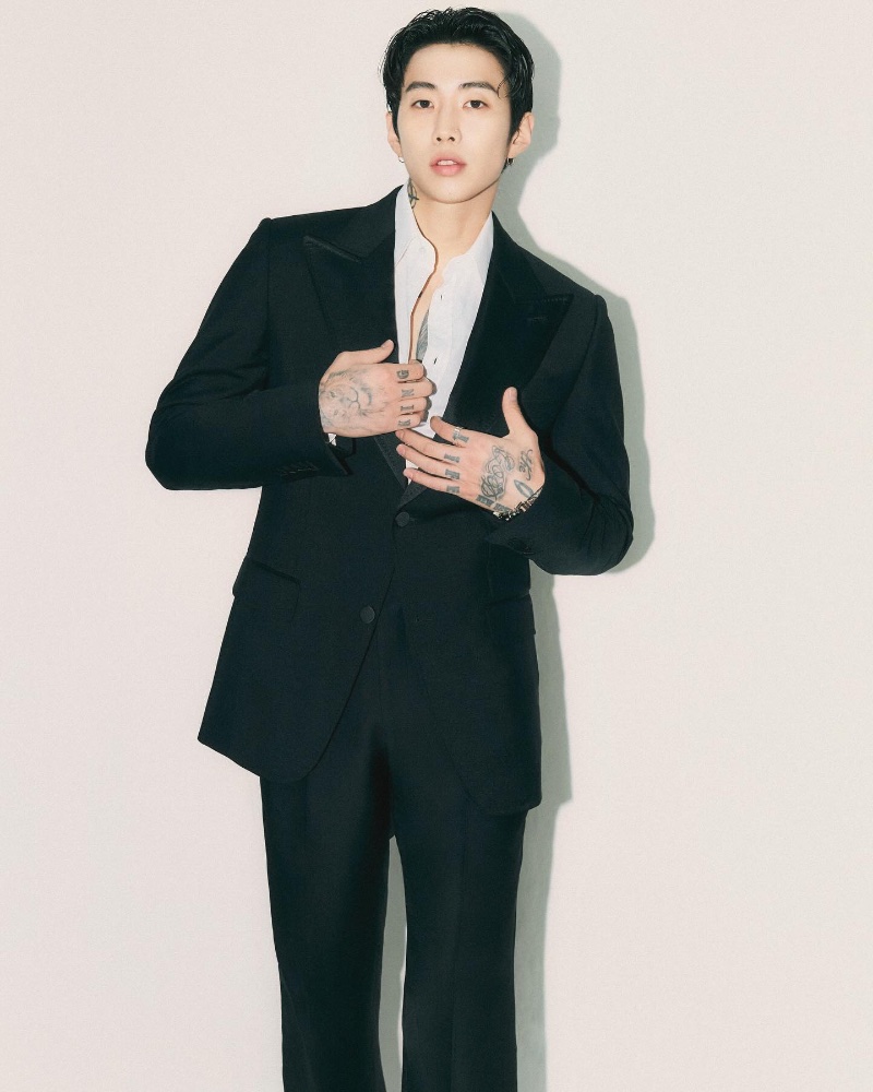 Dressed to impress, Jay Park represents Gucci with sophistication in a tailored suit, blending contemporary style with traditional elegance.