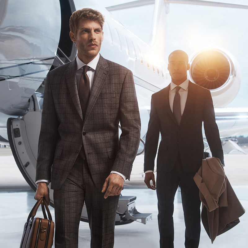 Baptiste Radufe and Malik Lindo clad in Michael Kors’ tailored suits, exude sophistication against the backdrop of a private jet for the fall-winter 2023 campaign.