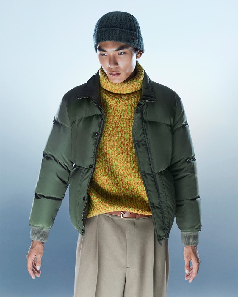 Embracing a pop of color in a King & Tuckfield wool turtleneck sweater, Keon Hee Lee also dons a Tom Ford technical down jacket and Gucci high-rise drill wide-leg pants.