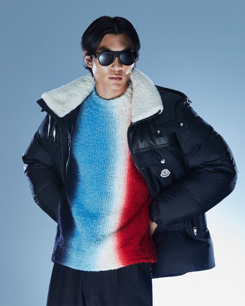 Keon Hee Lee sports a Moncler Braye shearling-trimmed down jacket with a Sacai tie-dye wool-blend sweater and Tom Ford Rex aviator sunglasses.