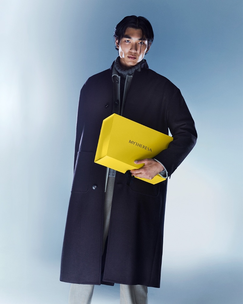 Model Keon Hee Lee makes a sleek statement in a Kiton virgin wool coat. 