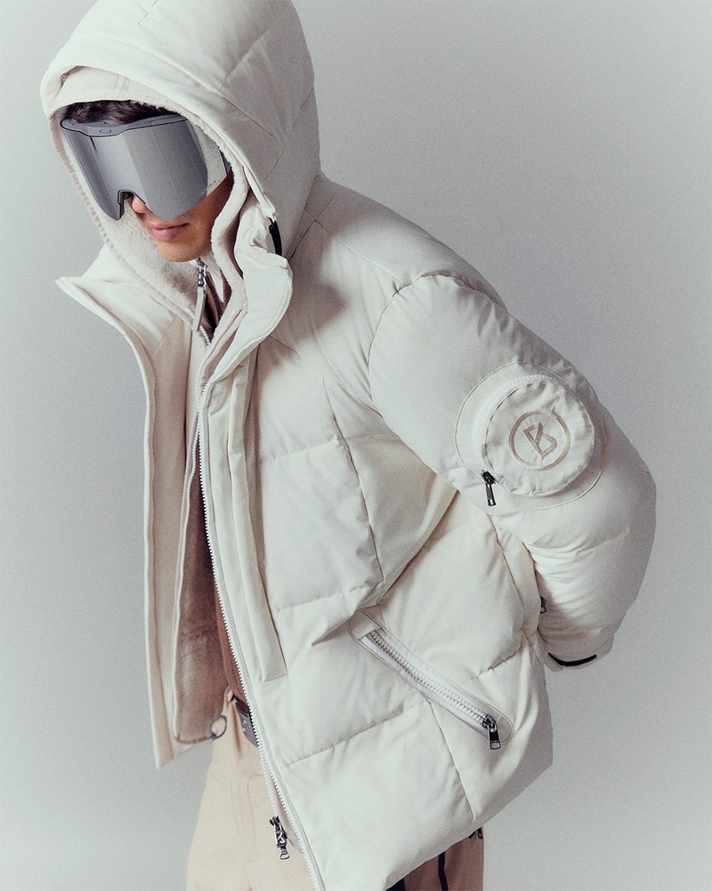 Jivago Santini is the epitome of winter sophistication in a luxe Bogner puffer jacket, accessorized with statement ski goggles for a perfect blend of style and function on the slopes.
