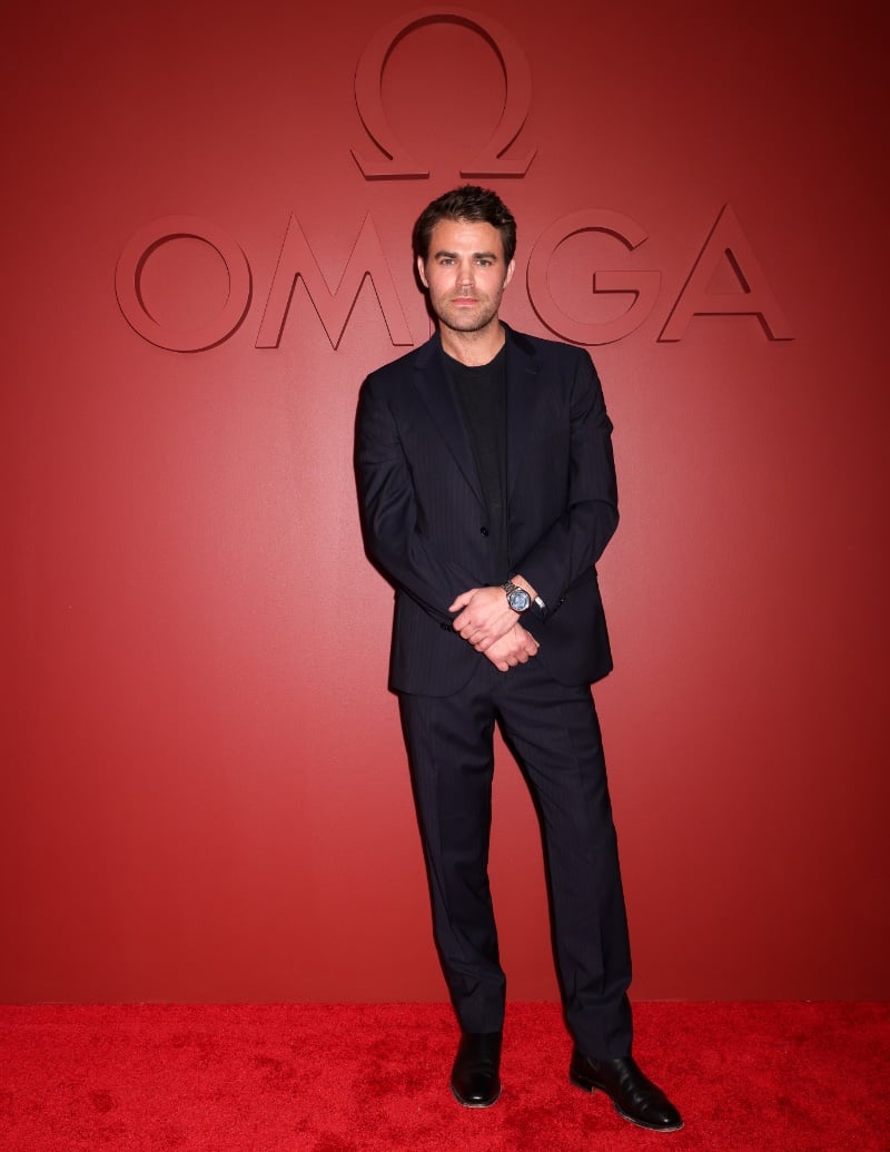Paul Wesley embraces a monochromatic look to attend Planet OMEGA.