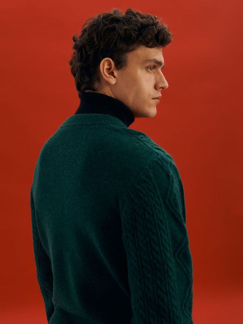 Reserved celebrates the holidays with festive pieces like a green sweater. 