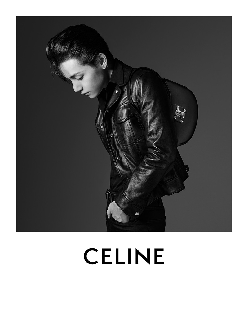 Capturing a contemplative moment, V showcases Celine's leather finesse with an over-the-shoulder glance.