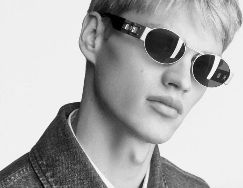 Filip Hrivnak rocks Versace Medusa Deco Oval Sunglasses for the brand's fall-winter 2023 campaign.