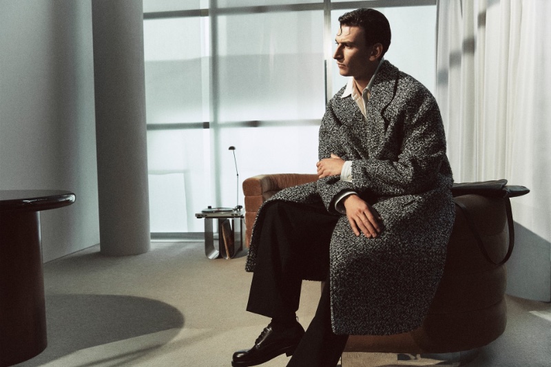Against the soft light, Thibaud Charon is the picture of modernity in a herringbone coat from the Zara Edition fall-winter 2023 Fundamentals collection.