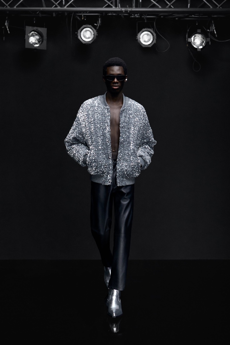 Hammam Pelewura sports a sequin bomber jacket with leather pants and silver boots.