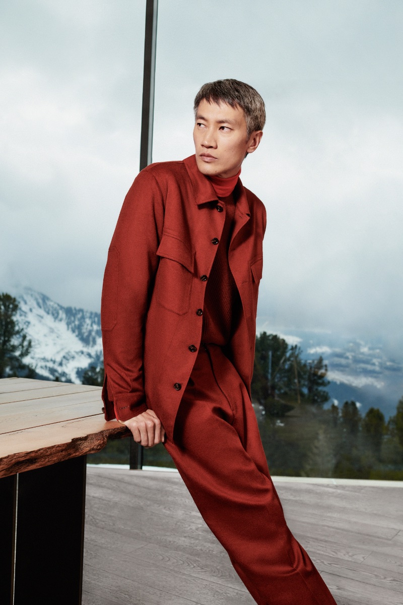 Embracing monochromatic style, Philip Huang wears a dark red Zegna ensemble for the brand's fall-winter 2023 campaign. 