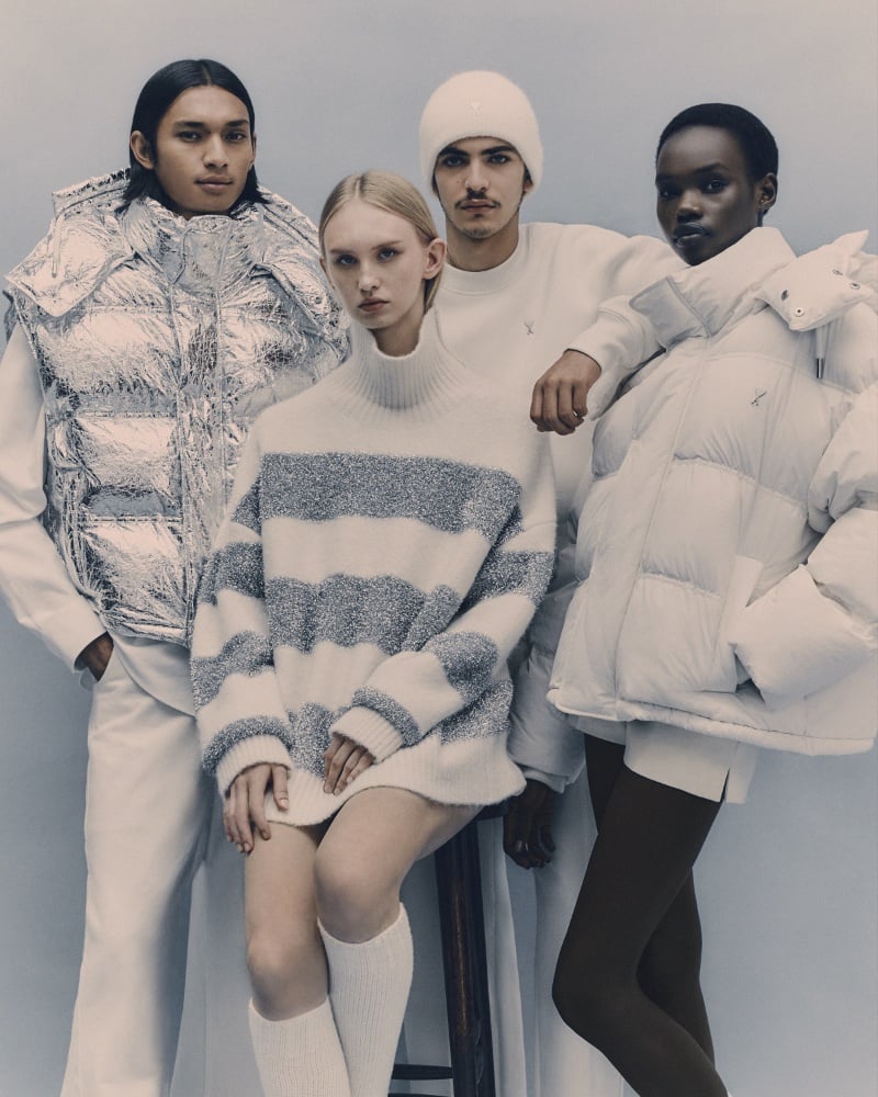 AMI unveils its winter 2023 collection with a striking mix of textures and layers, from a chunky knit sweater to a shiny metallic vest. 