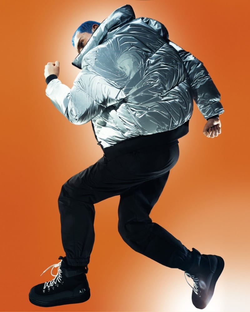 Kit Price captures the spirit of motion in a metallic puffer jacket for Armani Exchange's fall-winter 2023 campaign.