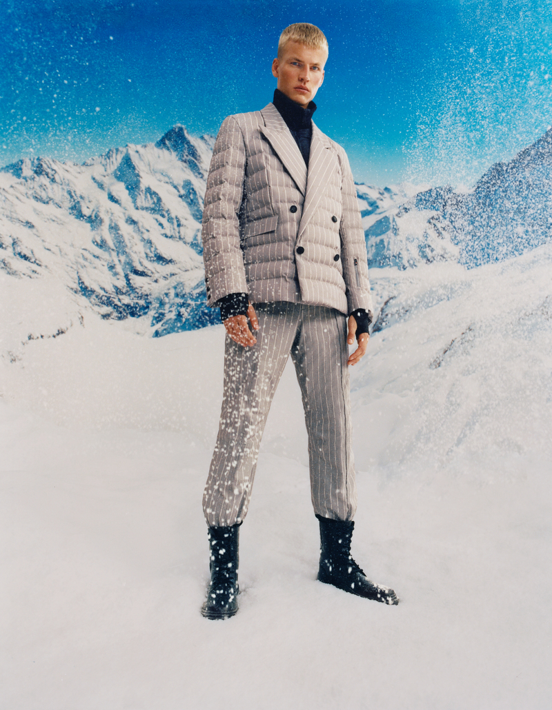 Timo Pan exudes elegance in a tailored, BOSS x Perfect Moment pinstriped winter suit complemented by a turtleneck. 