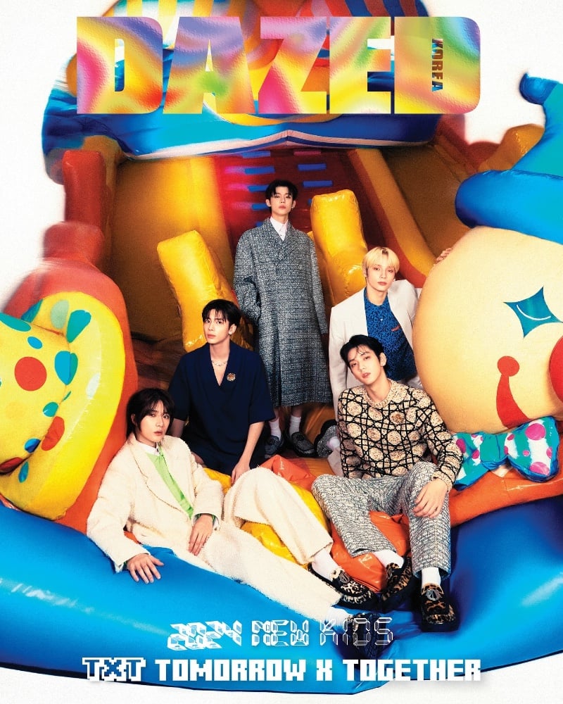 Tomorrow x Together pose with laid-back charm amidst a colorful inflatable playground on the cover of Dazed Korea.