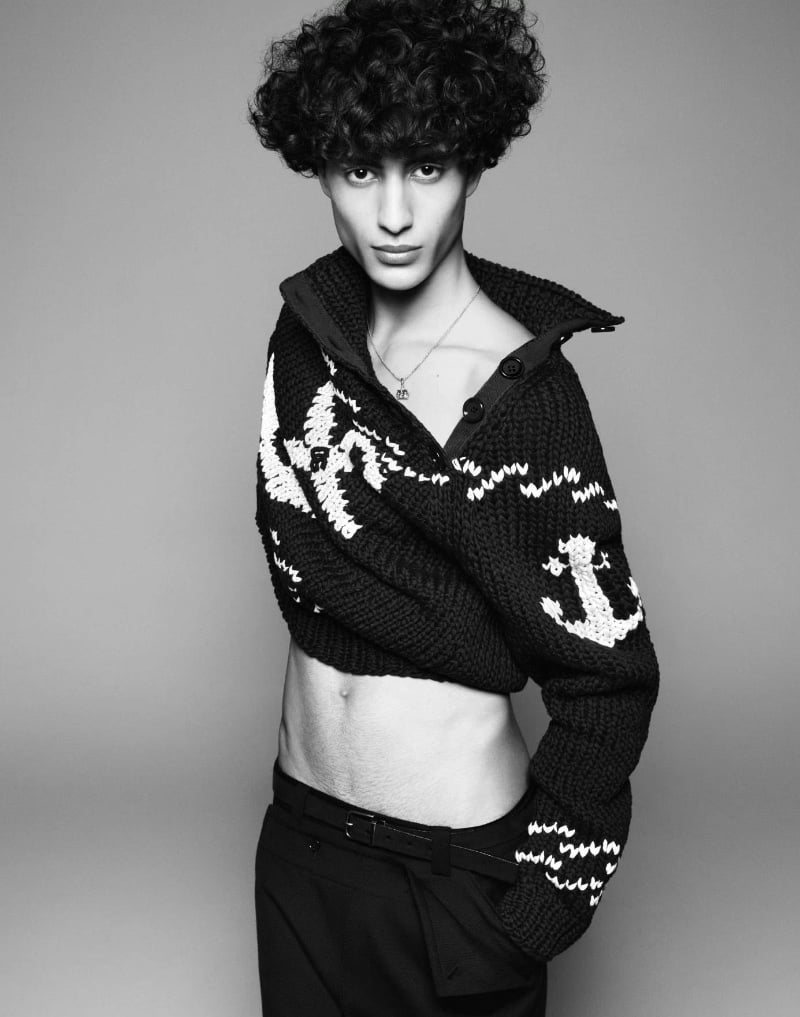 Yoesry Detre wears a textured turtleneck sweater with a nautical flair from Dolce & Gabbana's Marina collection.
