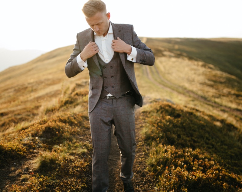 Classic patterns like a windowpane print add subtle character to a groom's 3-piece suit