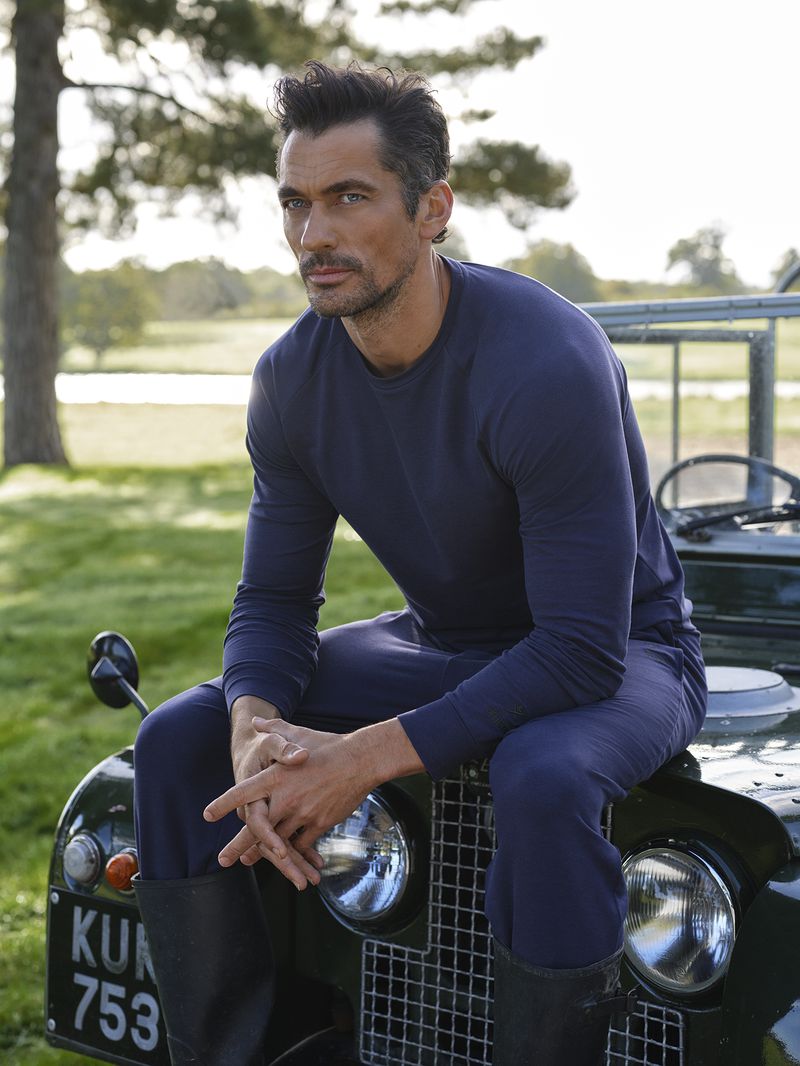 Dressed in navy, David Gandy wears a casual look from the Hackett x David Gandy Wellwear collection.