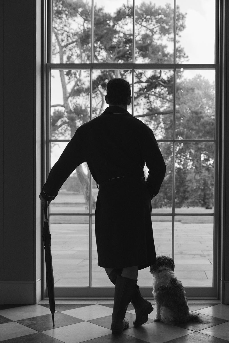 Captured in a black-and-white image, David Gandy dons a Hackett x David Gandy Wellwear robe.
