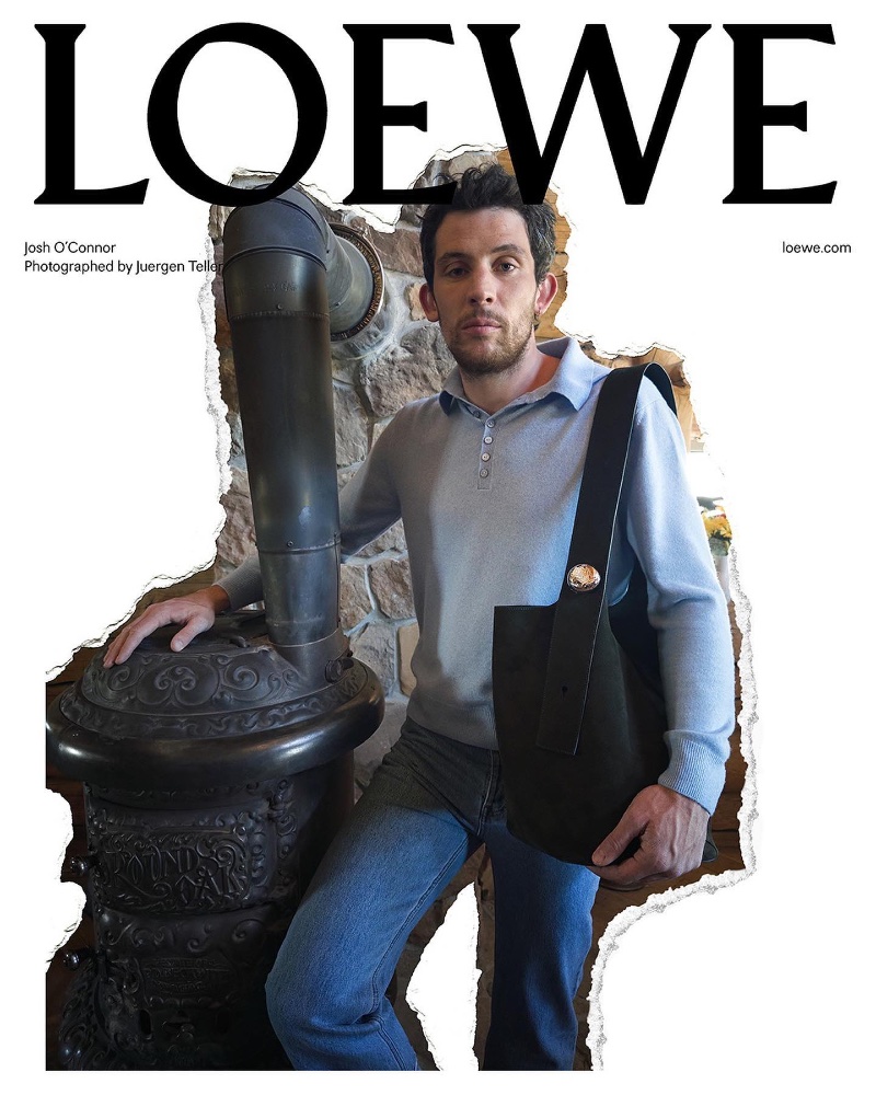 Josh O'Connor wears a long-sleeve polo, jeans, and a bag for Loewe's pre-spring 2024 campaign.