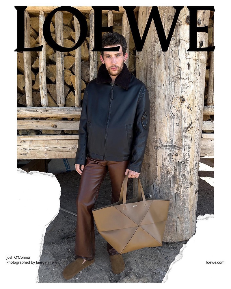Josh O'Connor showcases a Loewe leather jacket and oversized tote for the brand's pre-spring 2024 advertisement.