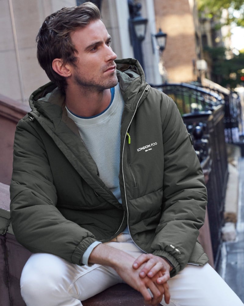 RJ King sports a practical yet stylish London Fog jacket, ready for a day's crisp breeze.