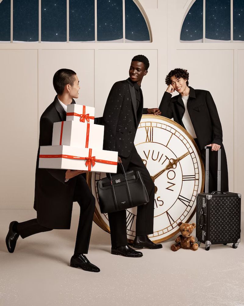 Wen Qiming, Ahmadou Gueye, and Mathieu Simoneau gather in a moment of timeless elegance, their sophisticated suits complemented by Louis Vuitton's iconic luggage.