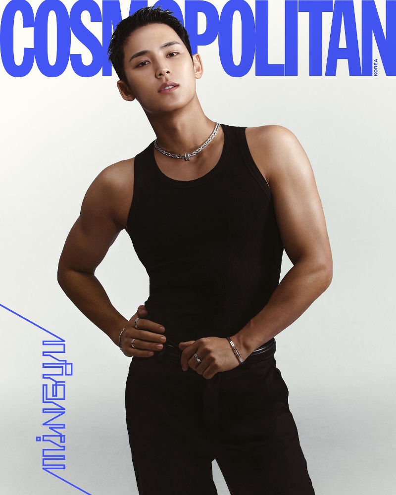 Mingyu from Seventeen strikes a confident pose in a black tank top, accented with a statement silver BVLGARI necklace, for Cosmopolitan Korea's December 2023 issue.