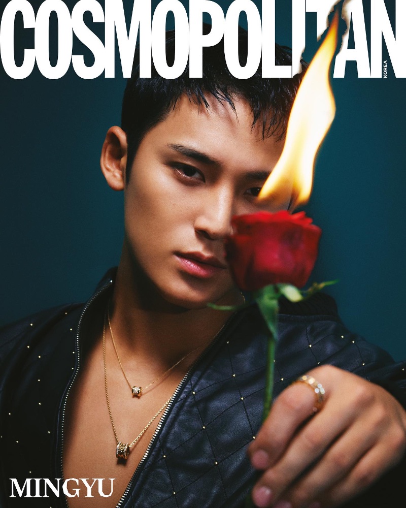 Mingyu holds a flaming rose, adorned in a studded leather jacket and layered BVLGARI necklaces for the December 2023 Cosmopolitan Korea.