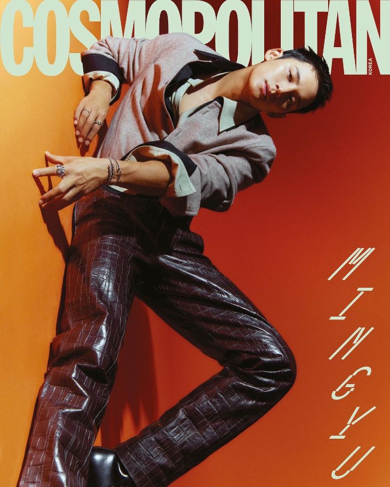 Mingyu makes a bold fashion statement in glossy crocodile-patterned pants, complemented by BVLGARI jewelry, for the Cosmopolitan Korea December 2023 cover.