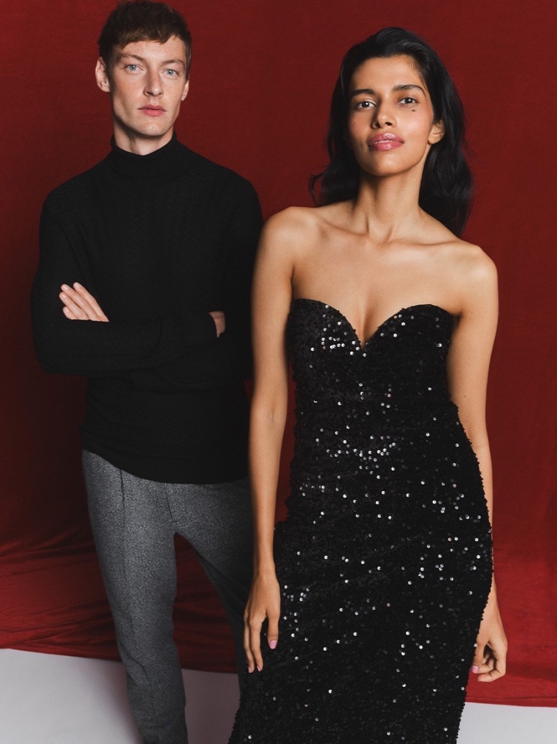 Wearing a turtleneck and trousers, Roberto Sipos appears alongside Pooja Mor in Reserved's holiday 2023 campaign.
