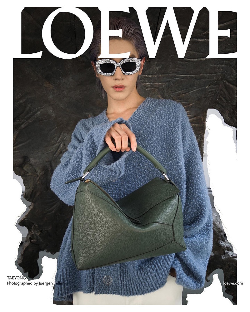 Taeyong captures a high-fashion moment in statement sunglasses and a textured cardigan for Loewe's pre-spring 2024 campaign.