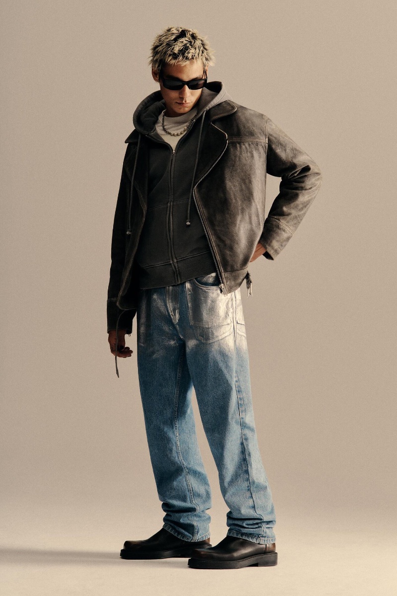 Zara enlists Evan Mock to model its washed leather jacket with a full-zip hoodie and straight-fit metallic jeans. 