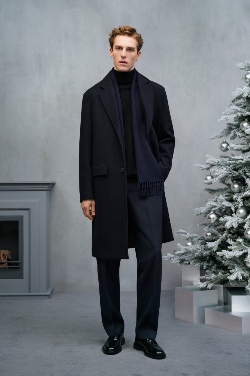 Quentin Demeester stands by minimal classics in an overcoat and turtleneck.