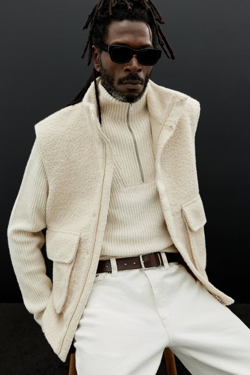 Virgile Elana exudes cool sophistication in Zara's knitwear, featuring a cream 3/4 zip pullover and coordinating vest.