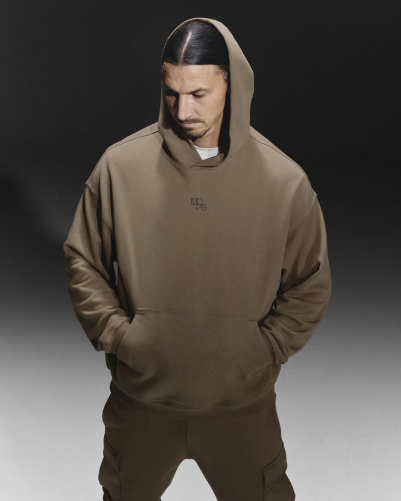 Zlatan Ibrahimović adopts a pensive look, clad in a monochrome brown H&M Move hoodie and matching joggers.